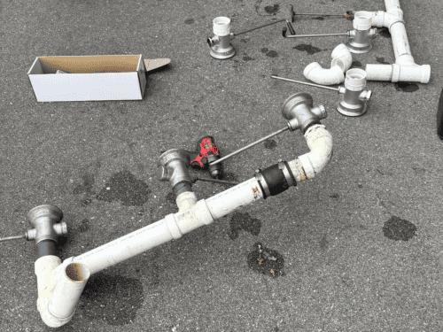 Brass valves and PVC fittings assembled for a water line repair