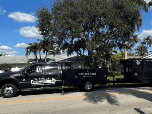 LCI Plumbing & Septic service truck parked at a residential job